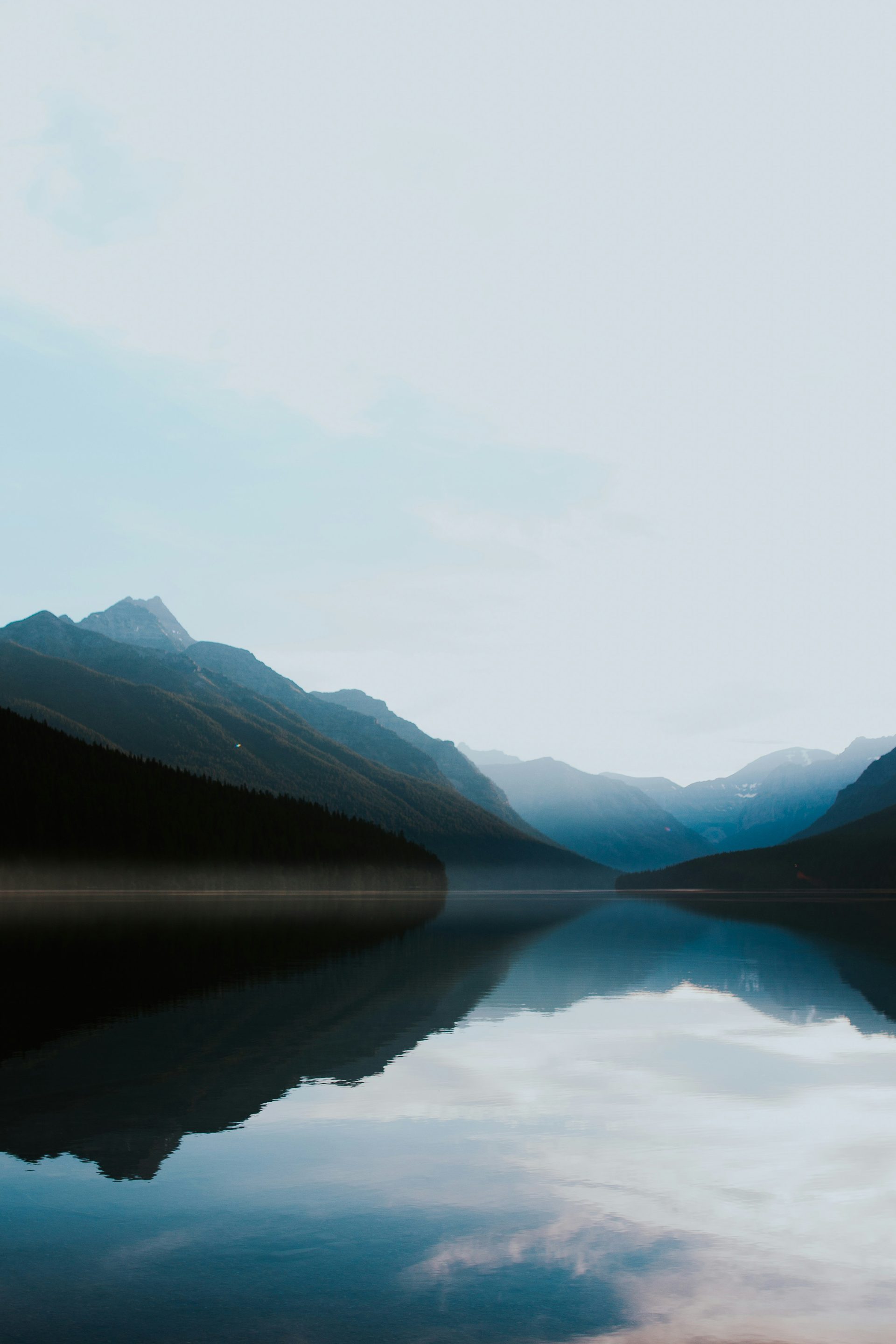 A dark lake against the mountains